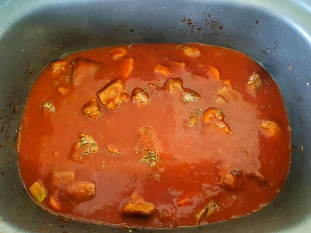 Ragu in slow cooker ready to add lid and cook.