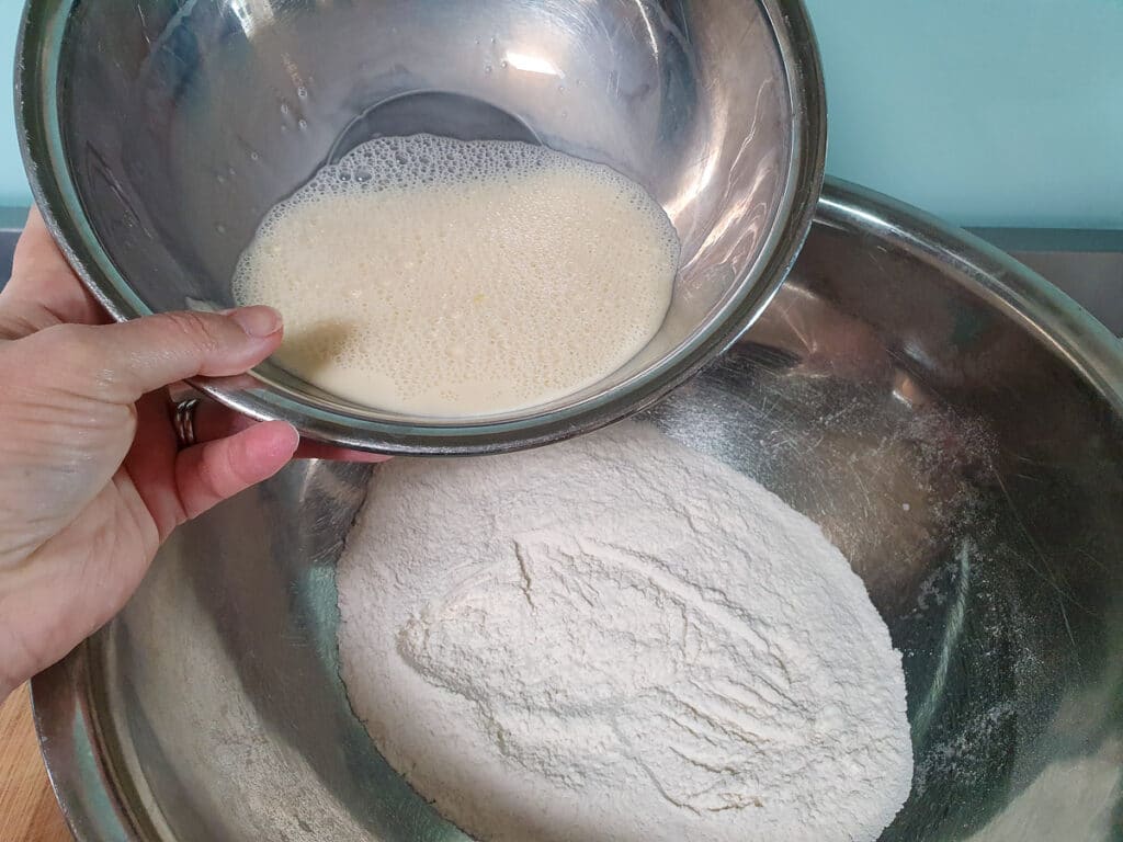 Adding whisked milk and egg to dry ingredients