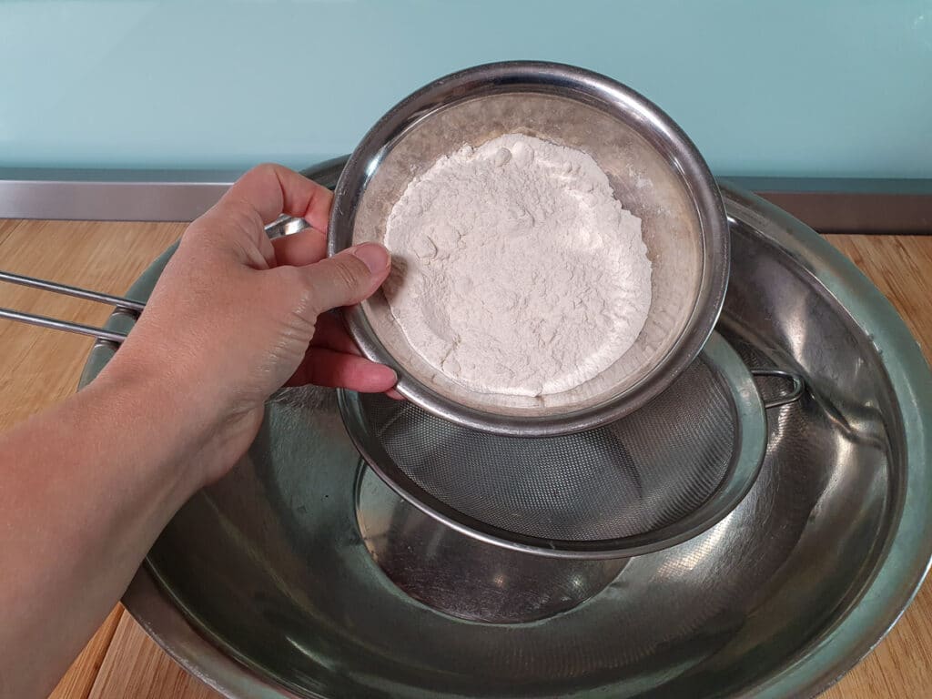 Sifting flour.