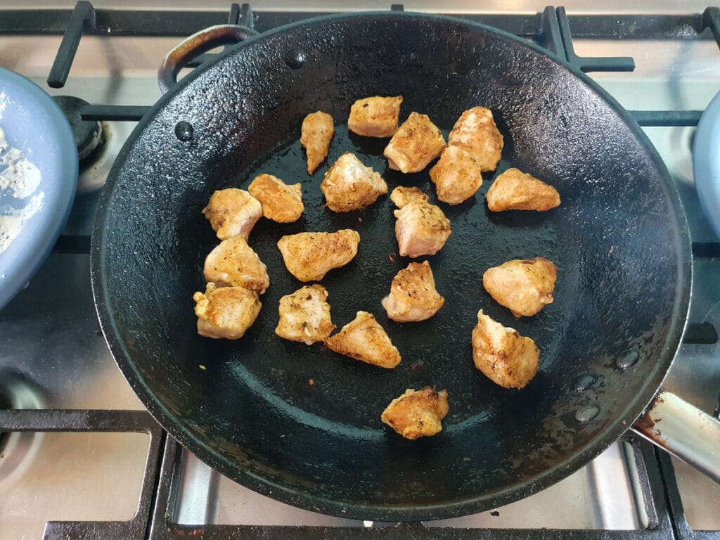 Pan frying chicken in batches.