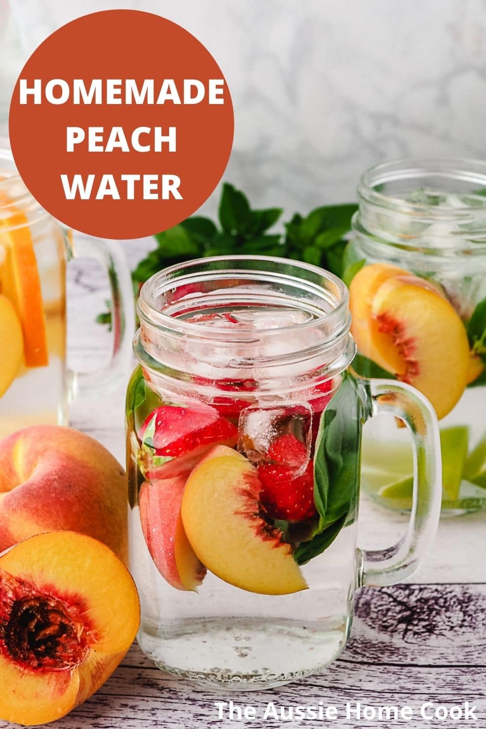 Peach infused water with strawberry and basil, with variants with other mix-ins in the background.